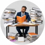 A man looks a a pile of outdated operating guidelines are realizes it's time for a business transformation.