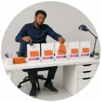 A picture showing a man doing repetitive tasks without automation and AI.