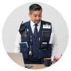 Man wearing a vest that shows too many jobs in his role design.